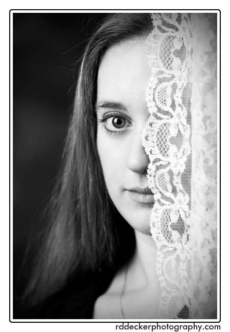 A less radical crop of Casey behind lace taken at my Newport, NC photography studio.